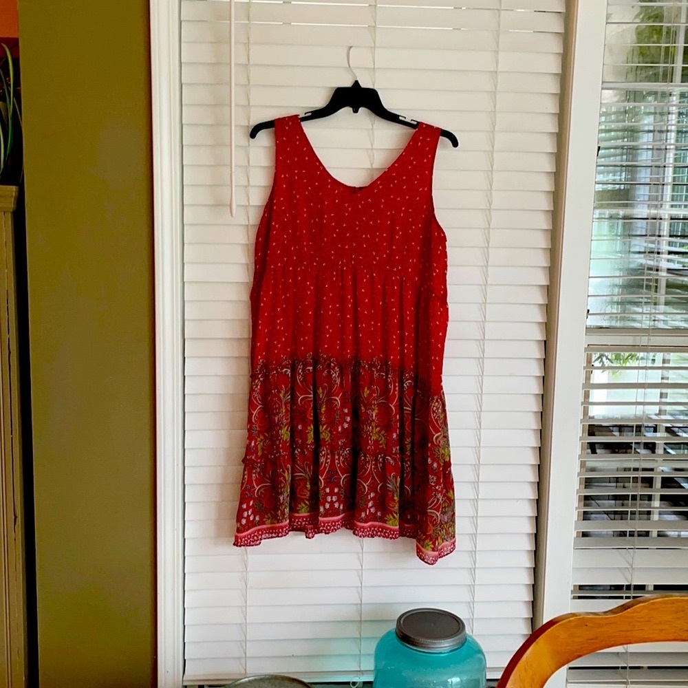 Red , floaty sleeveless dress.